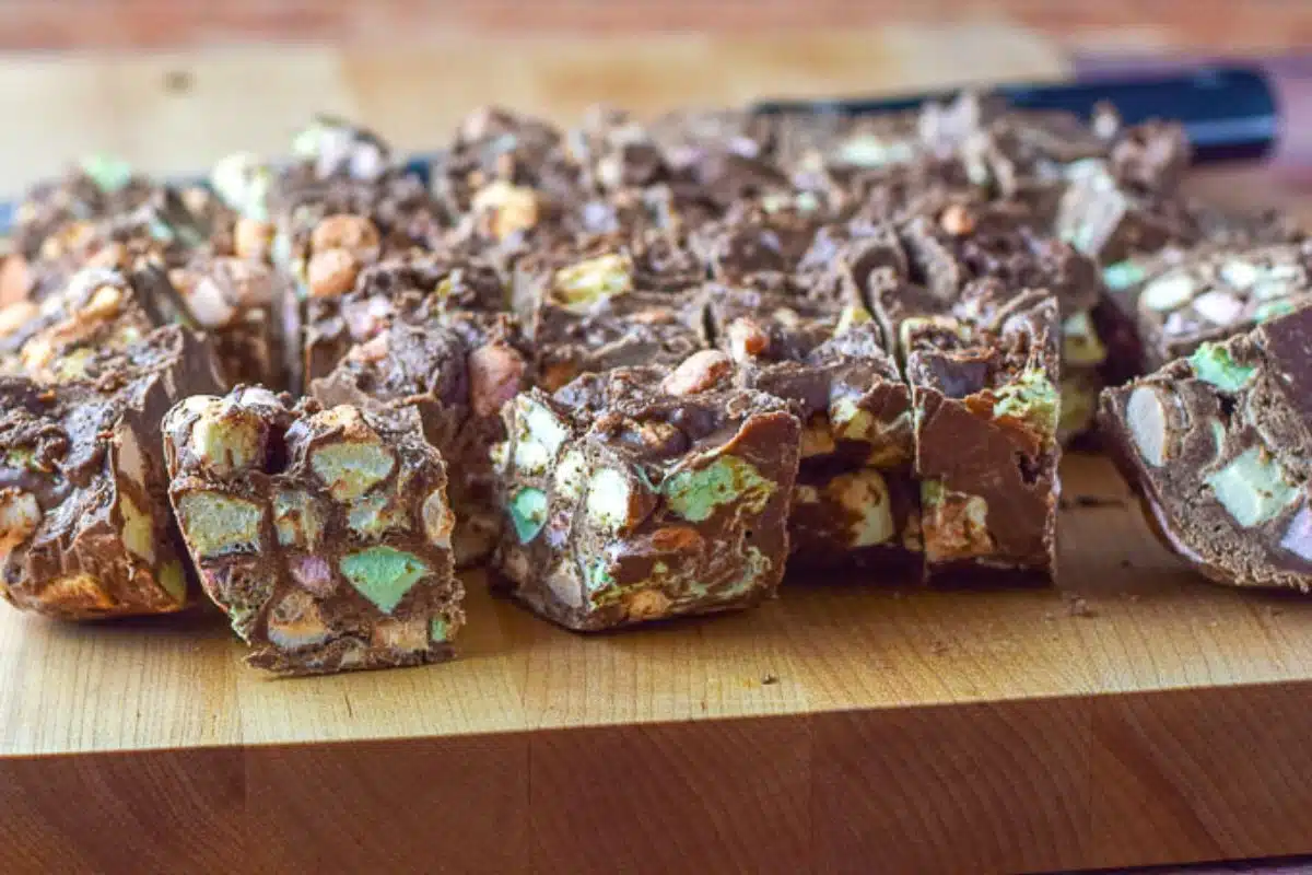 Fudge with marshmallows in it on a wood board