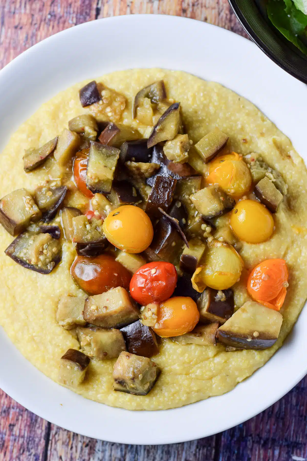 Overhead shot of the polenta with tomatoes and eggplant on top