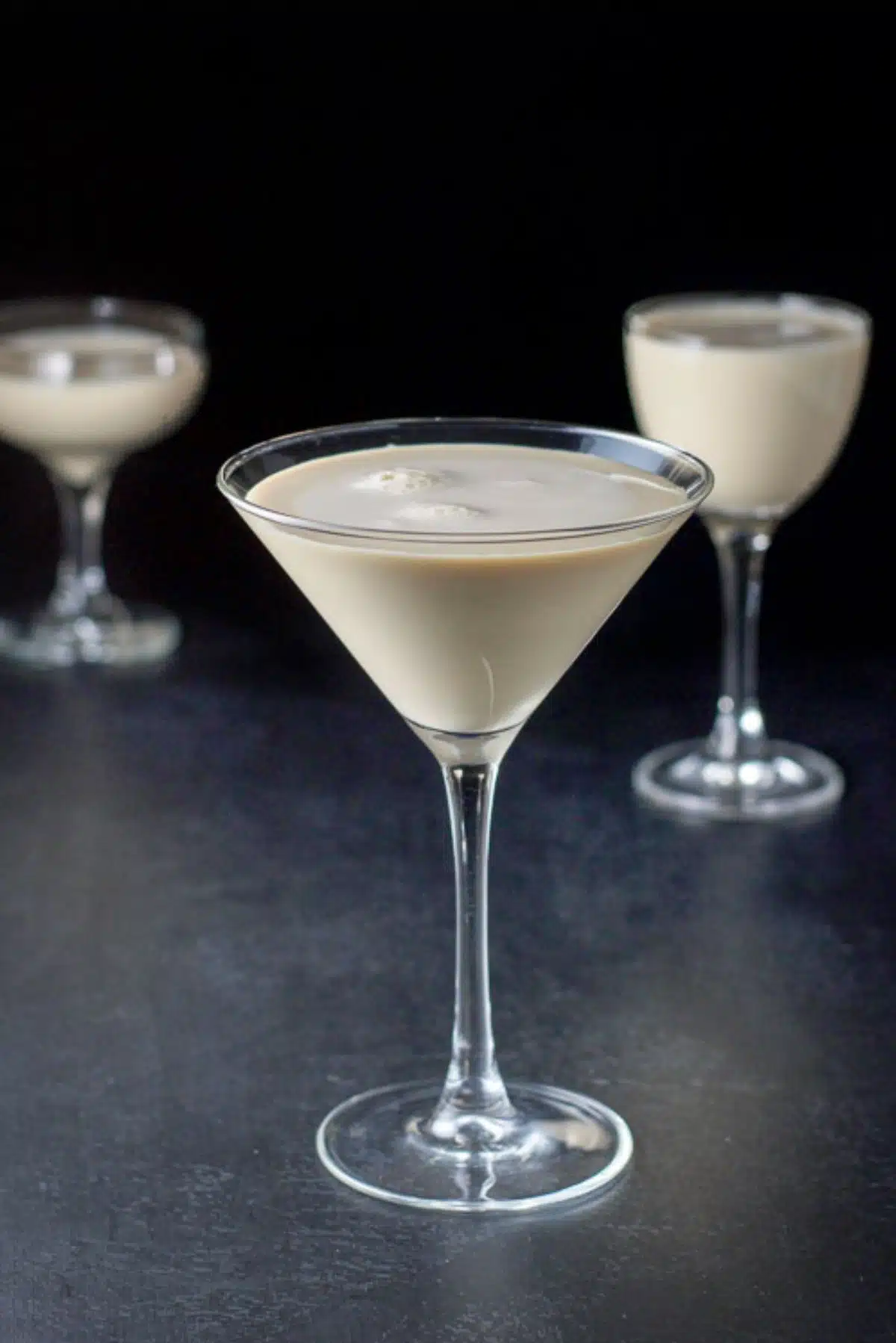 The creamy cocktail in three glasses. A classic glass, a coupe and a Nick and Nora glass