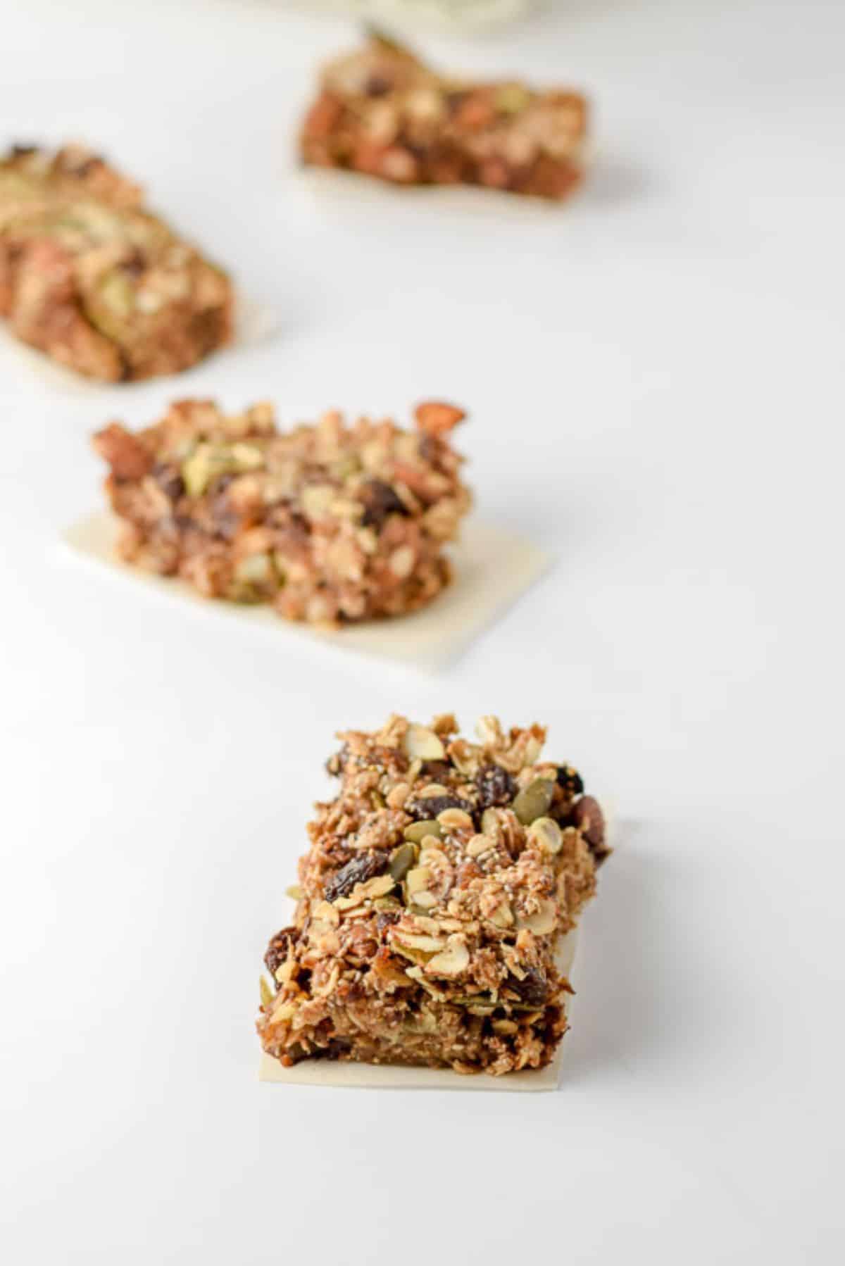 Four granola bars on a white table