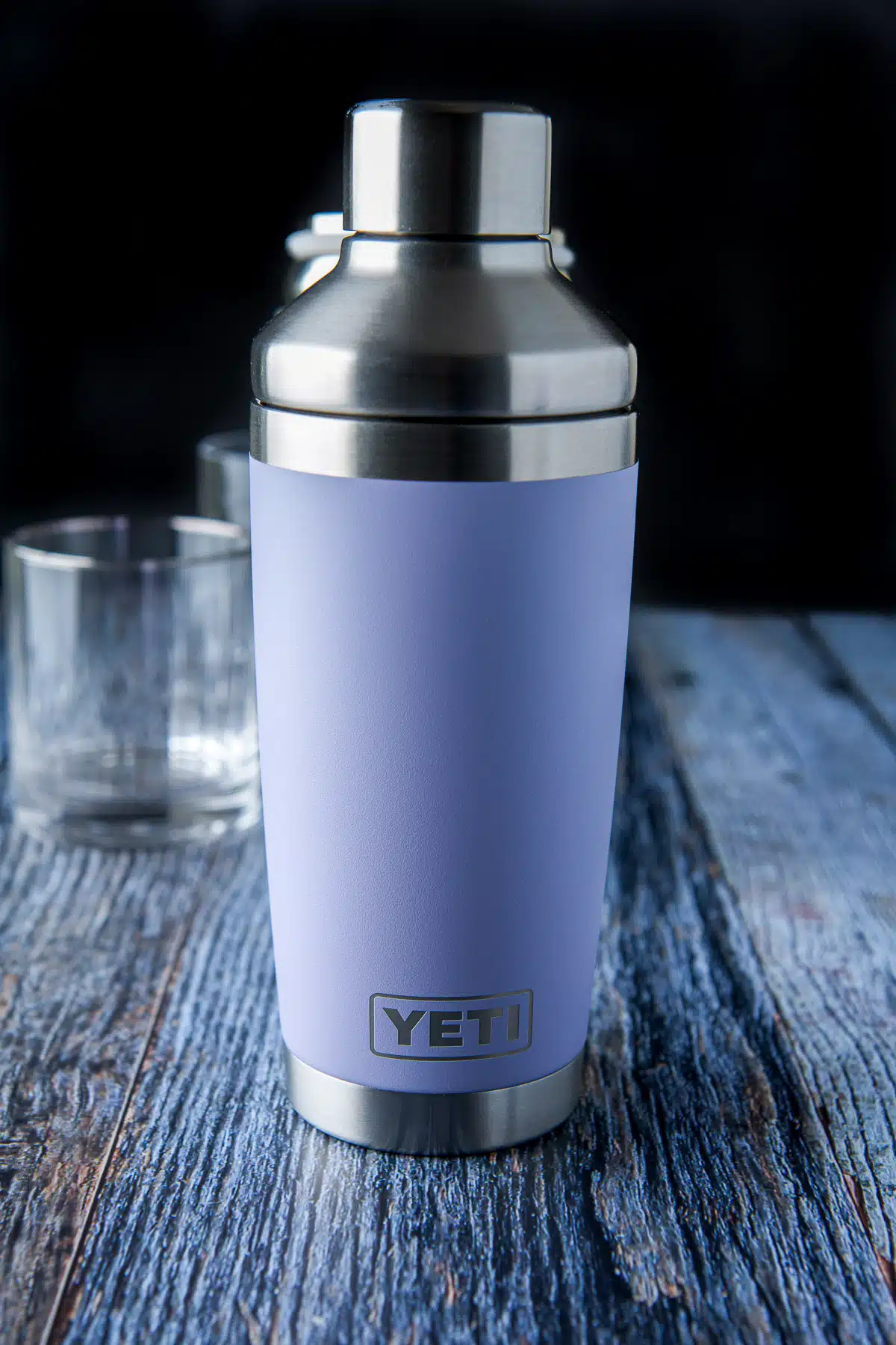 A Yeti brand cocktail shaker on a table with glasses