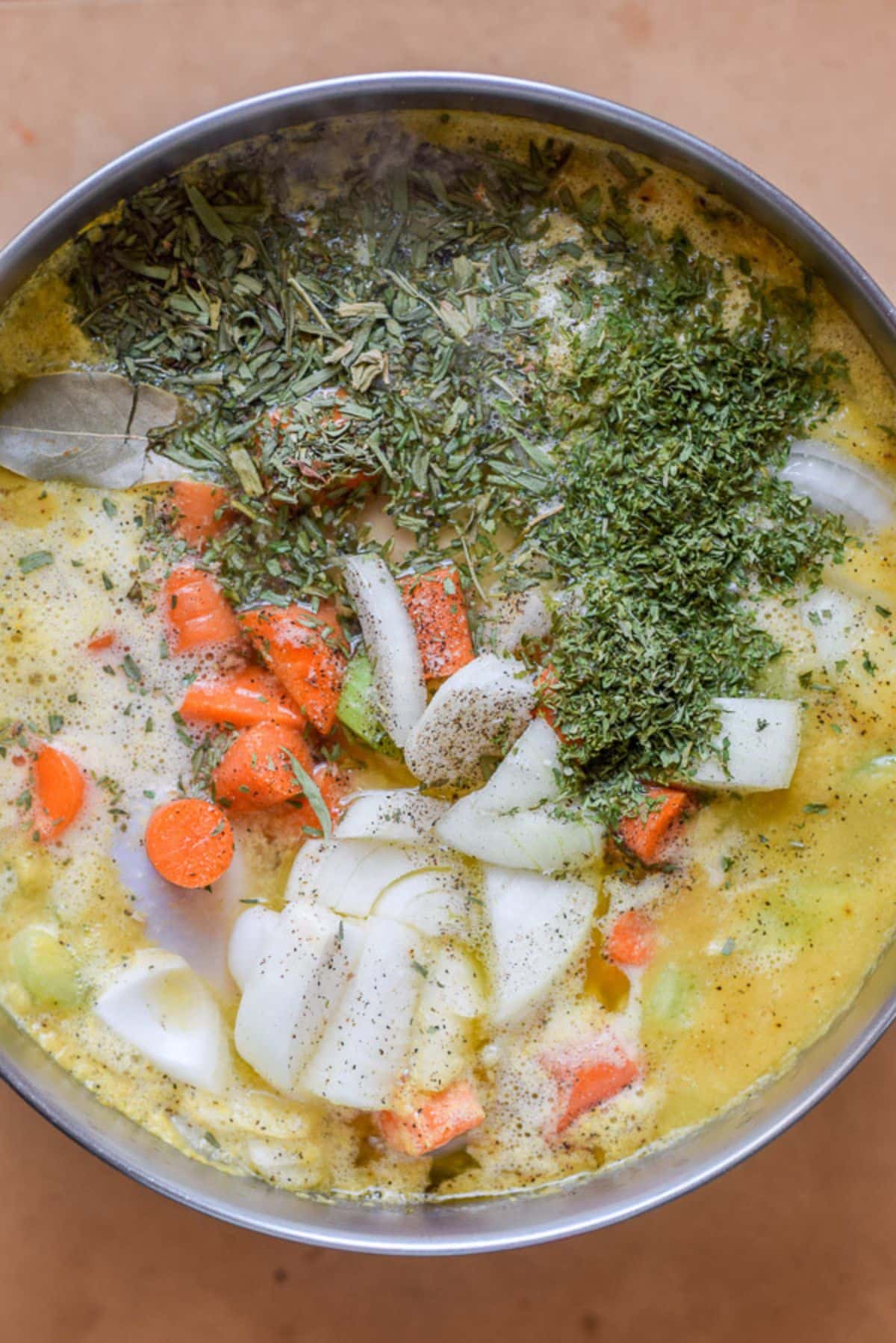 Overhead view of all the ingredients in the pan for the soup
