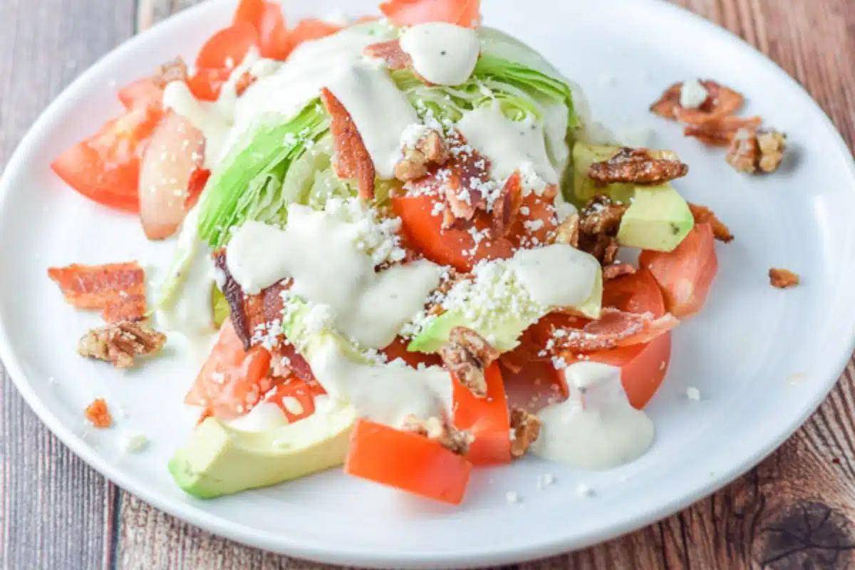blue cheese dressing on the wedge salad with all the fixings