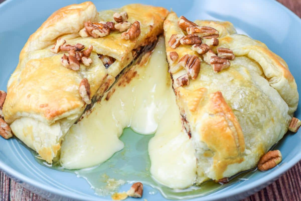A blue plate with baked brie in a pastry shop