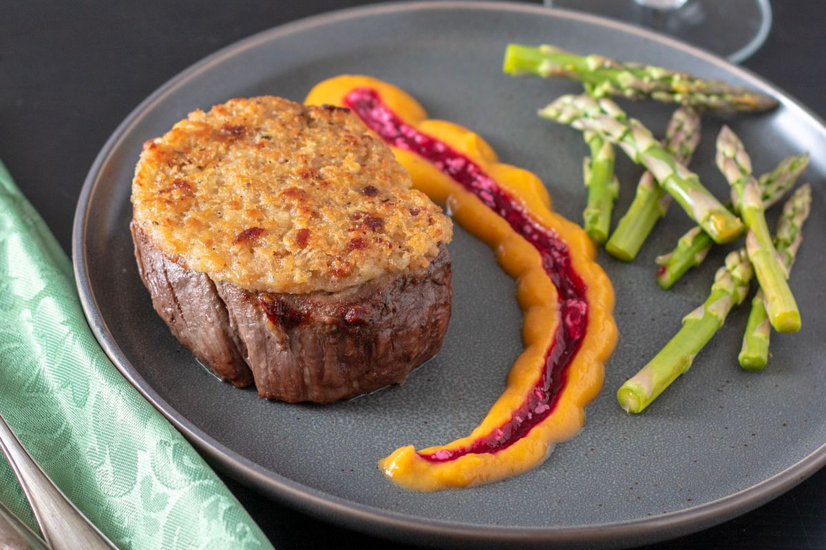 Horseradish on a plate with veggies on the side.