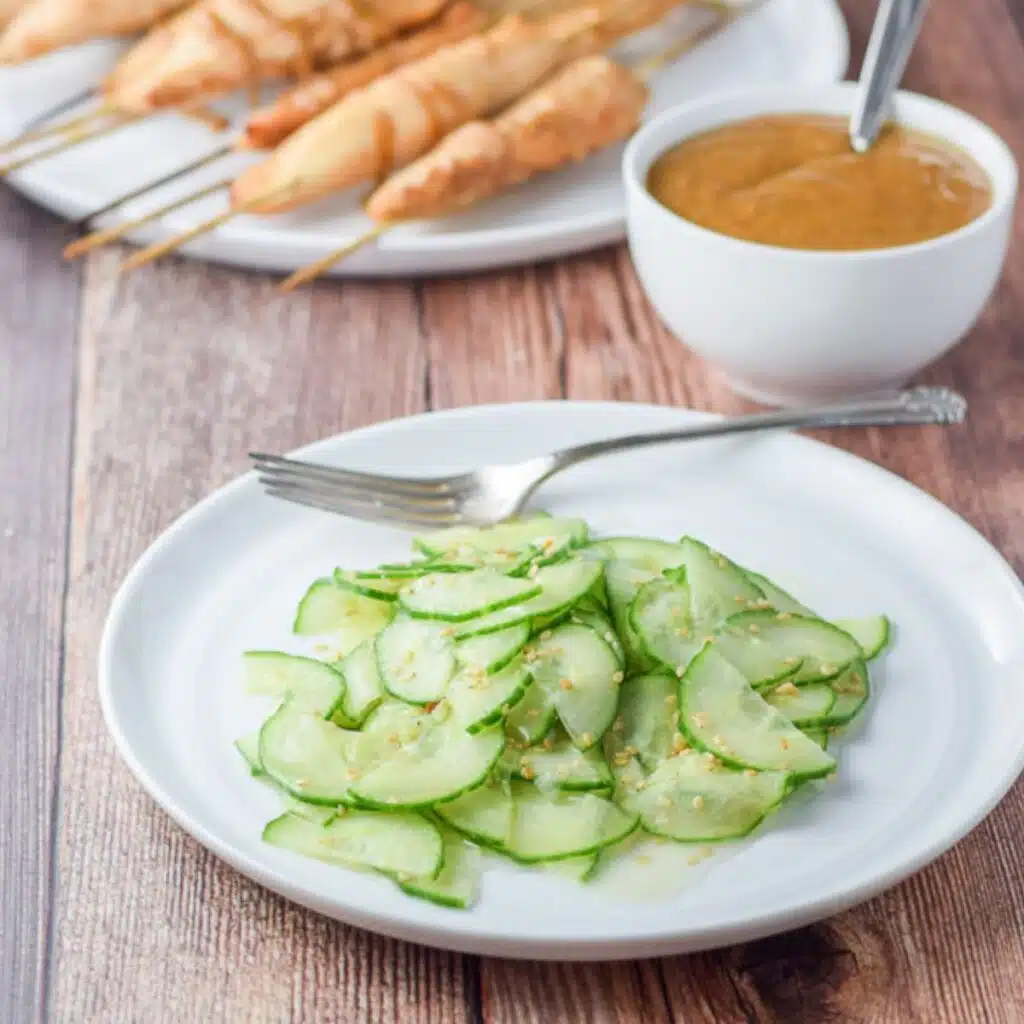 The cucumber with dressing served with chicken satay and peanut sauce