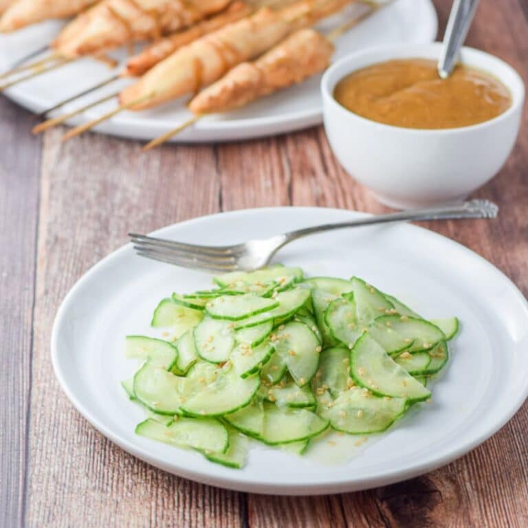 The cucumber with dressing served with chicken satay and peanut sauce