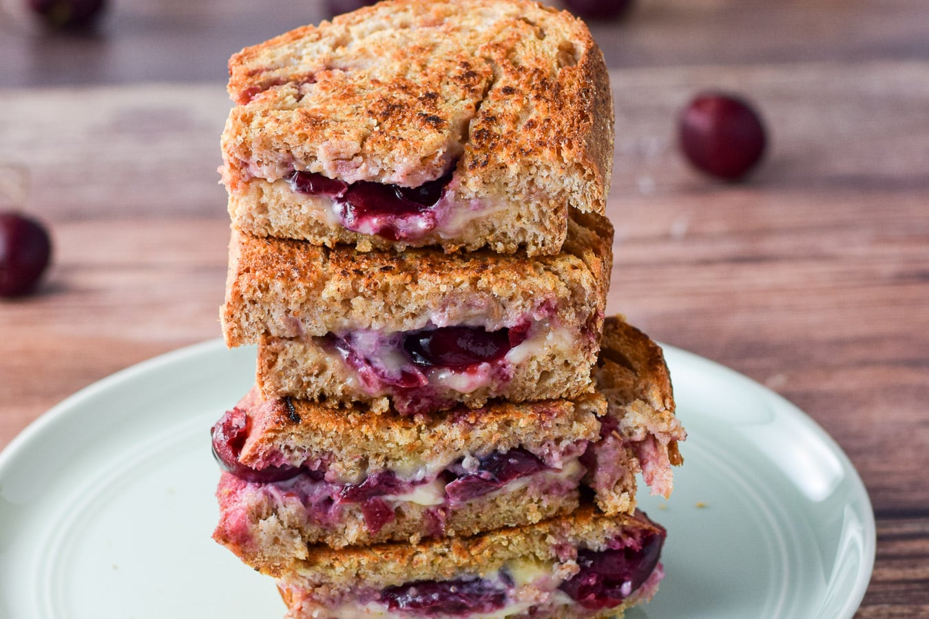 A horizontal photo of the grilled cherry cheese sandwich