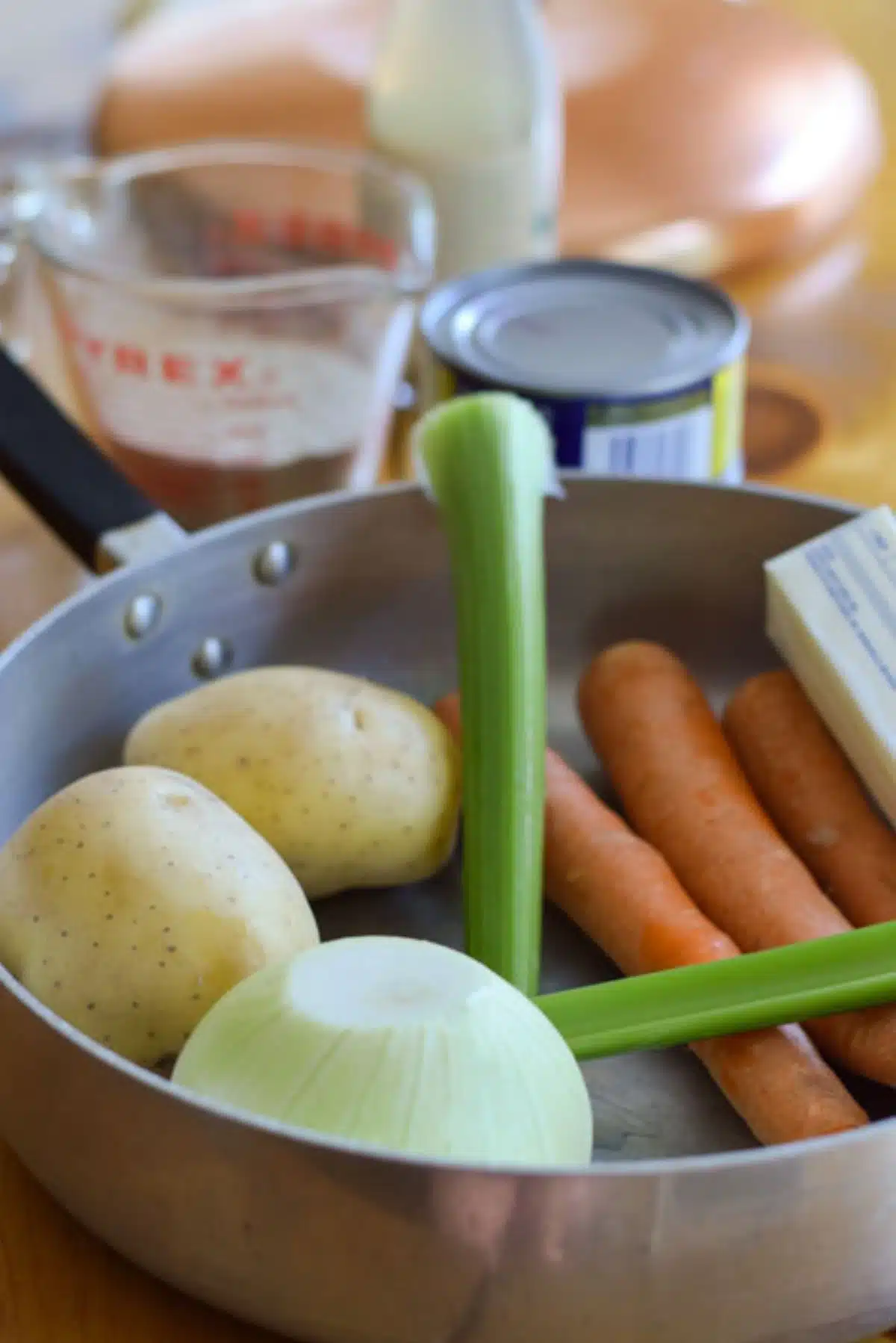 Onion, celery, carrots in a pan