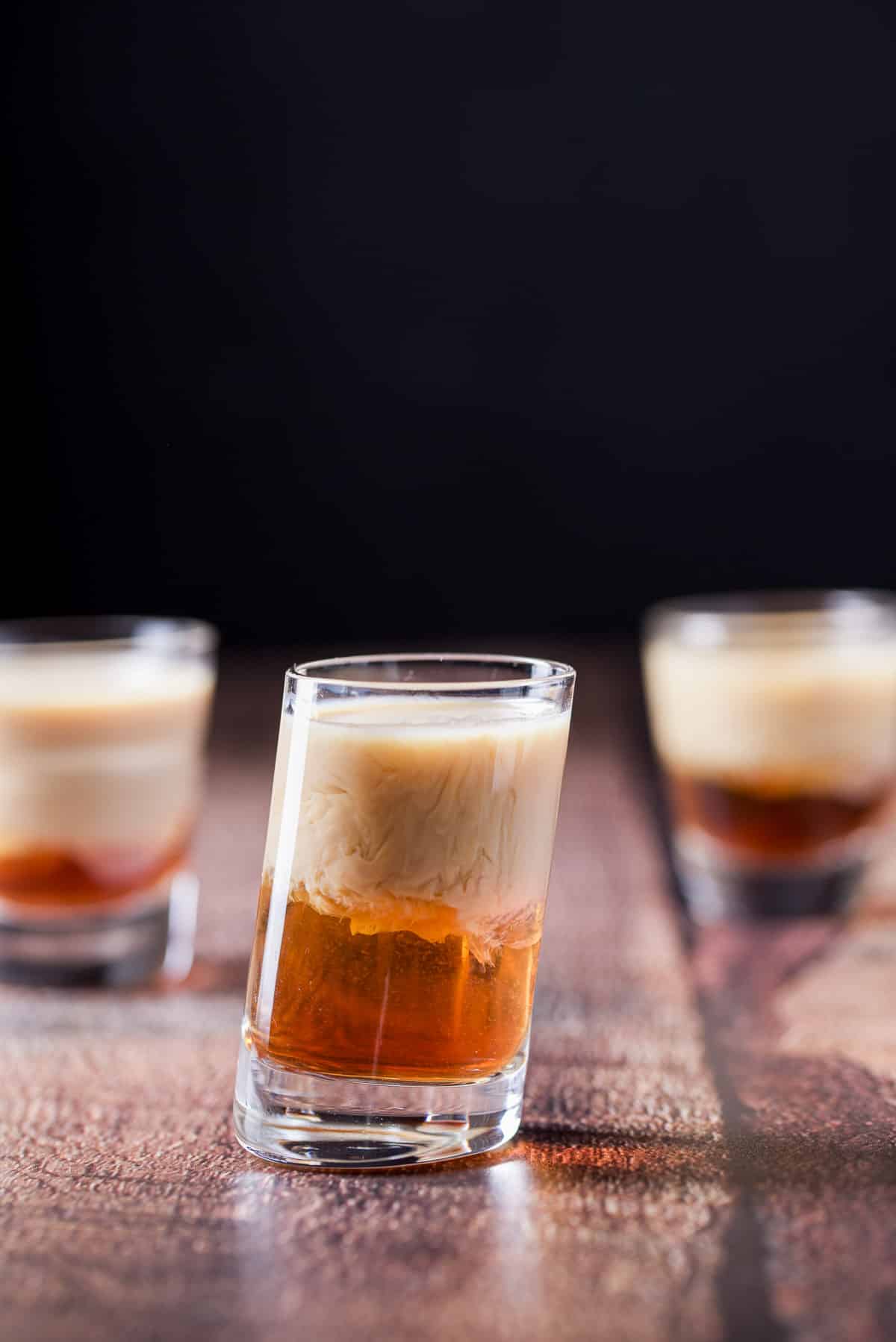 Baileys layered onto the other two ingredients. All the three glasses on the table