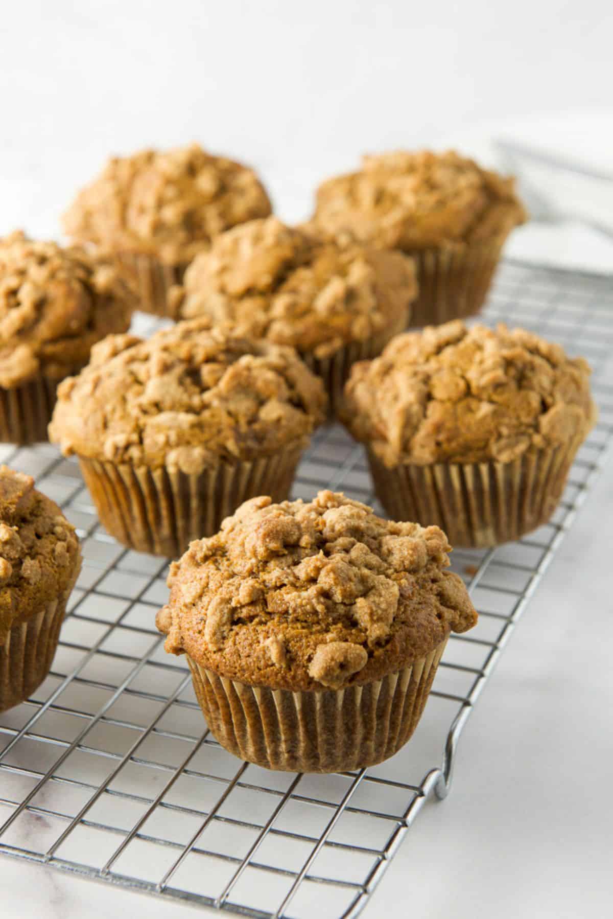 Pumpkin muffins cooling on a wire rack
