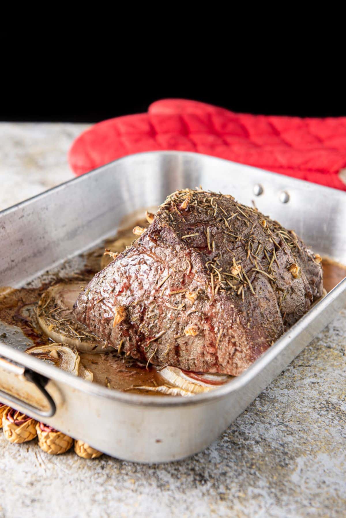 Roast beef straight out of the oven but still in the pan