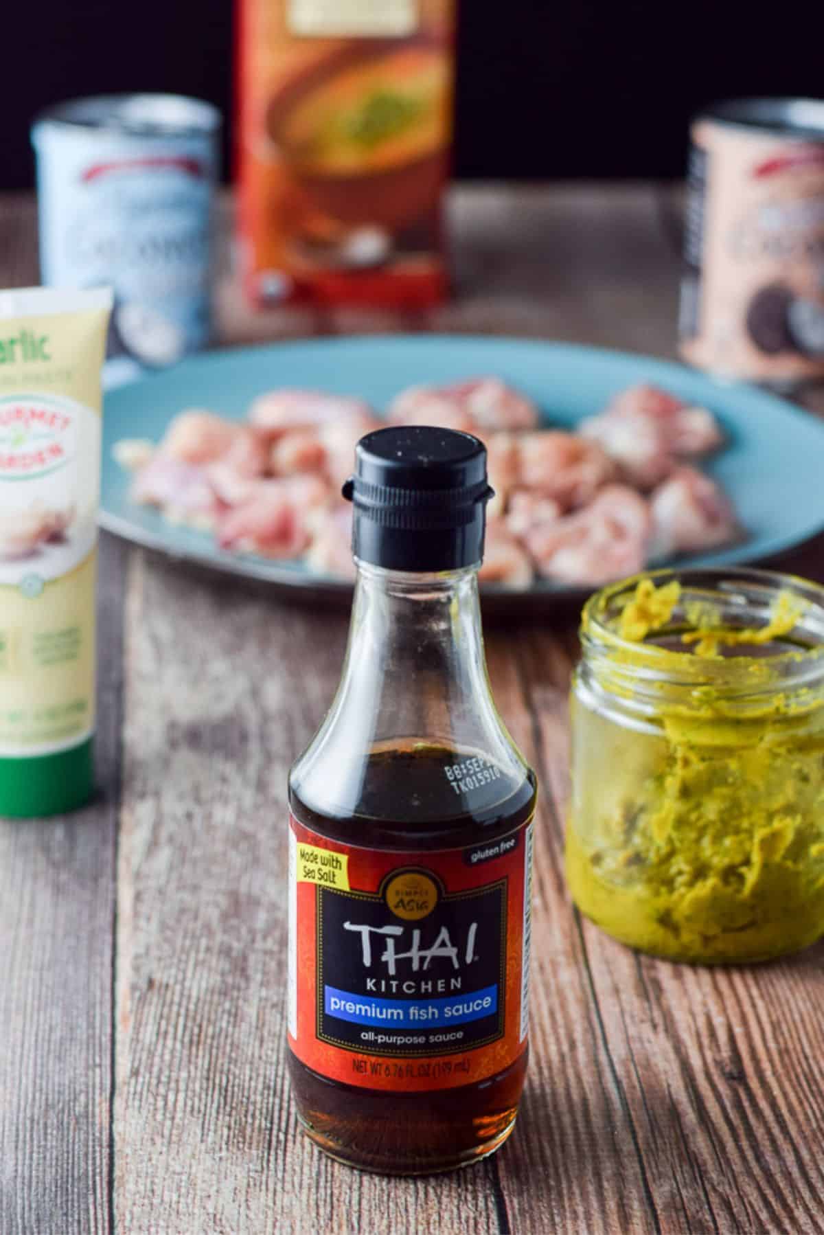 Fish sauce, curry paste, garlic paste, coconut milk and cream, broth and chicken chunks