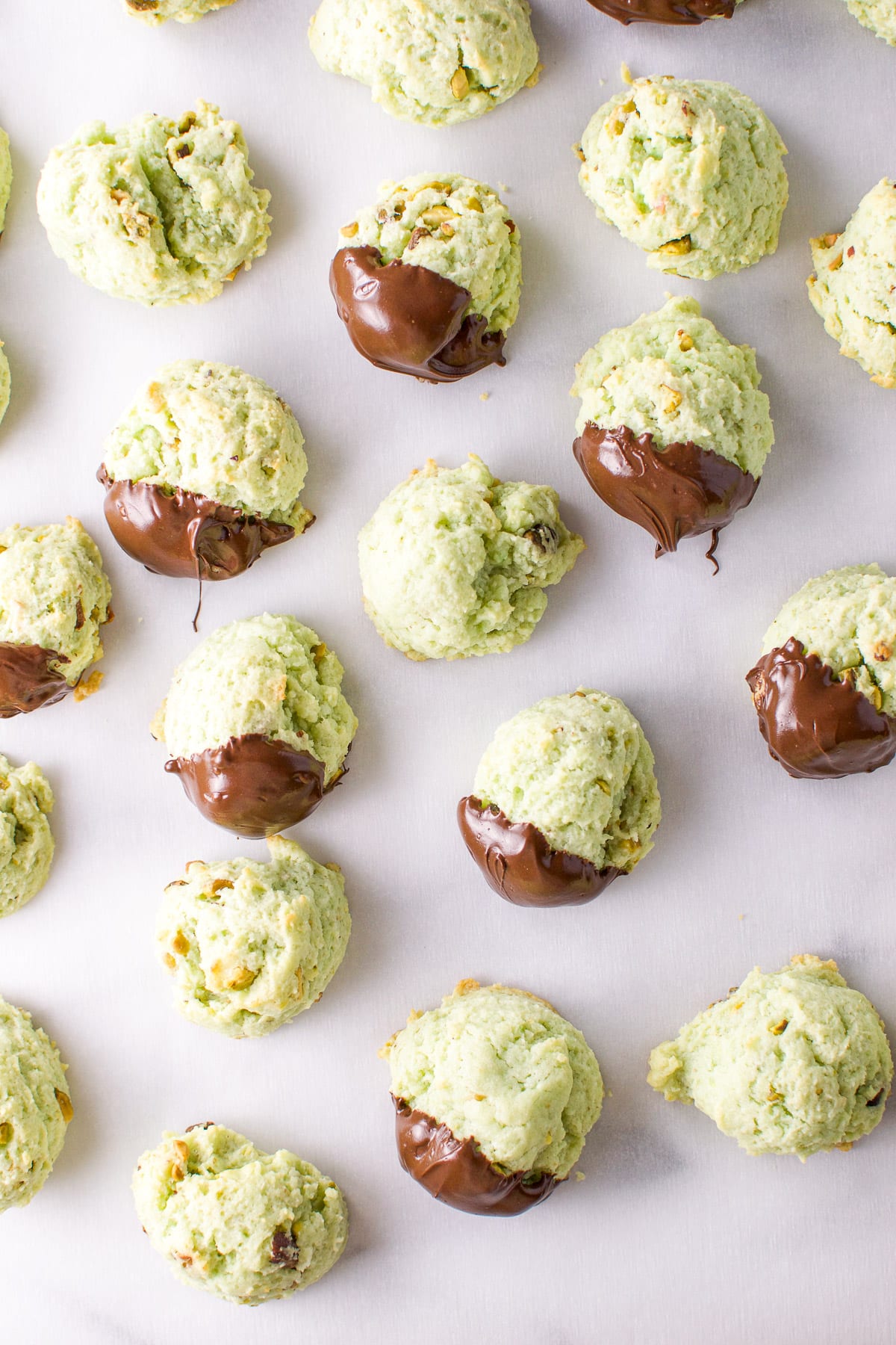 Overhead view of the cookies, some that have been dipped in chocolate