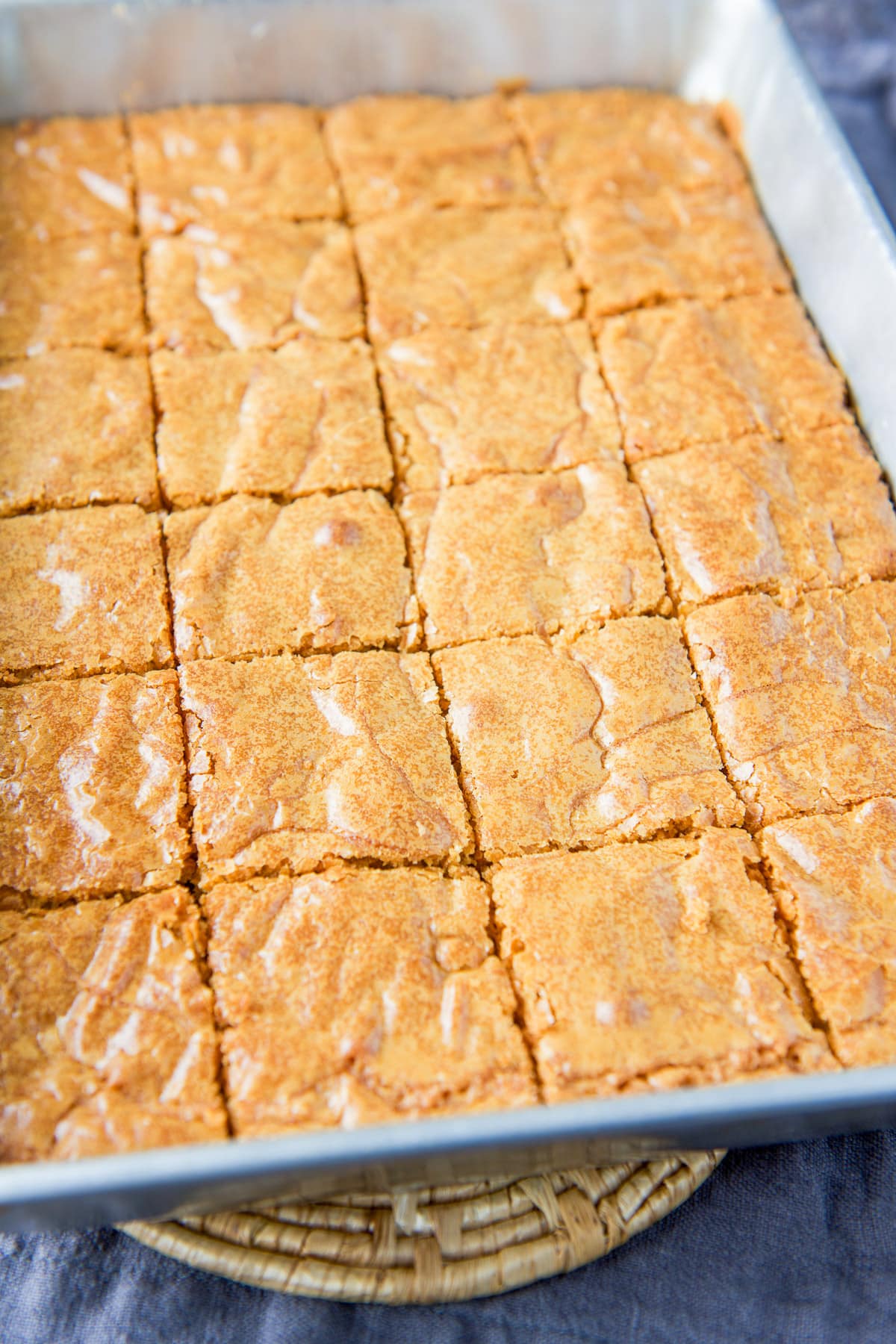 A pan with the cut blonde brownie squares in it