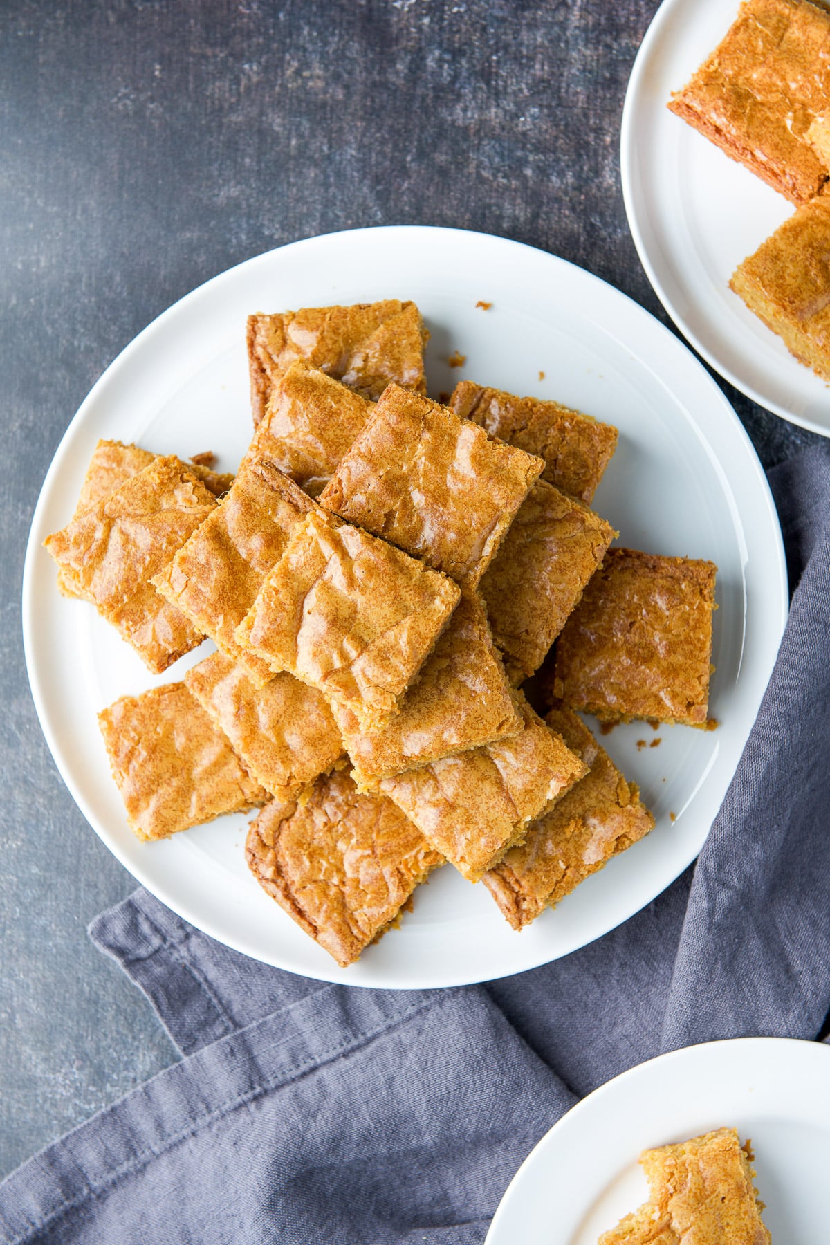 Overhead view of the butterscotch squares on the white plates