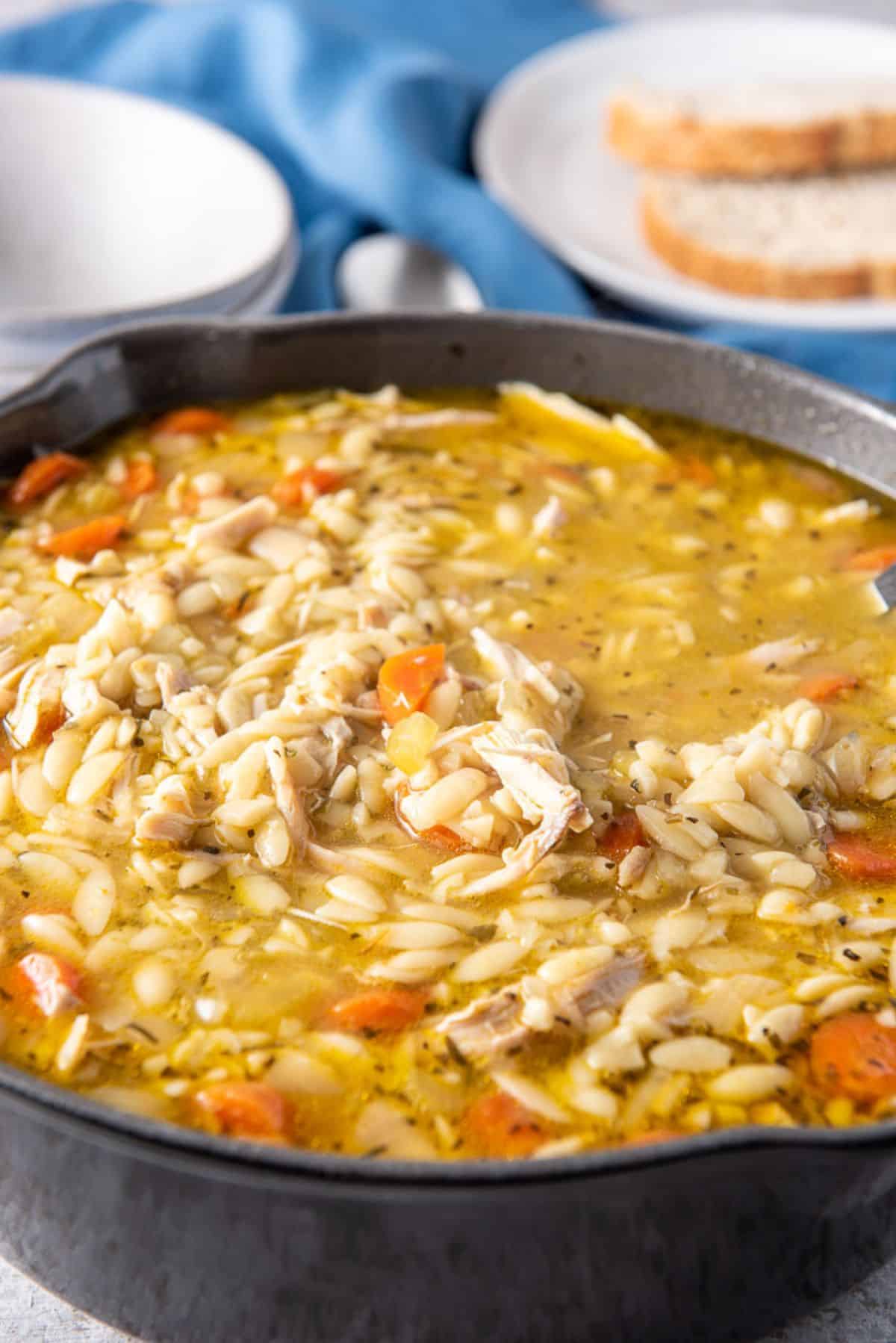 Cast iron pan filled with chicken soup