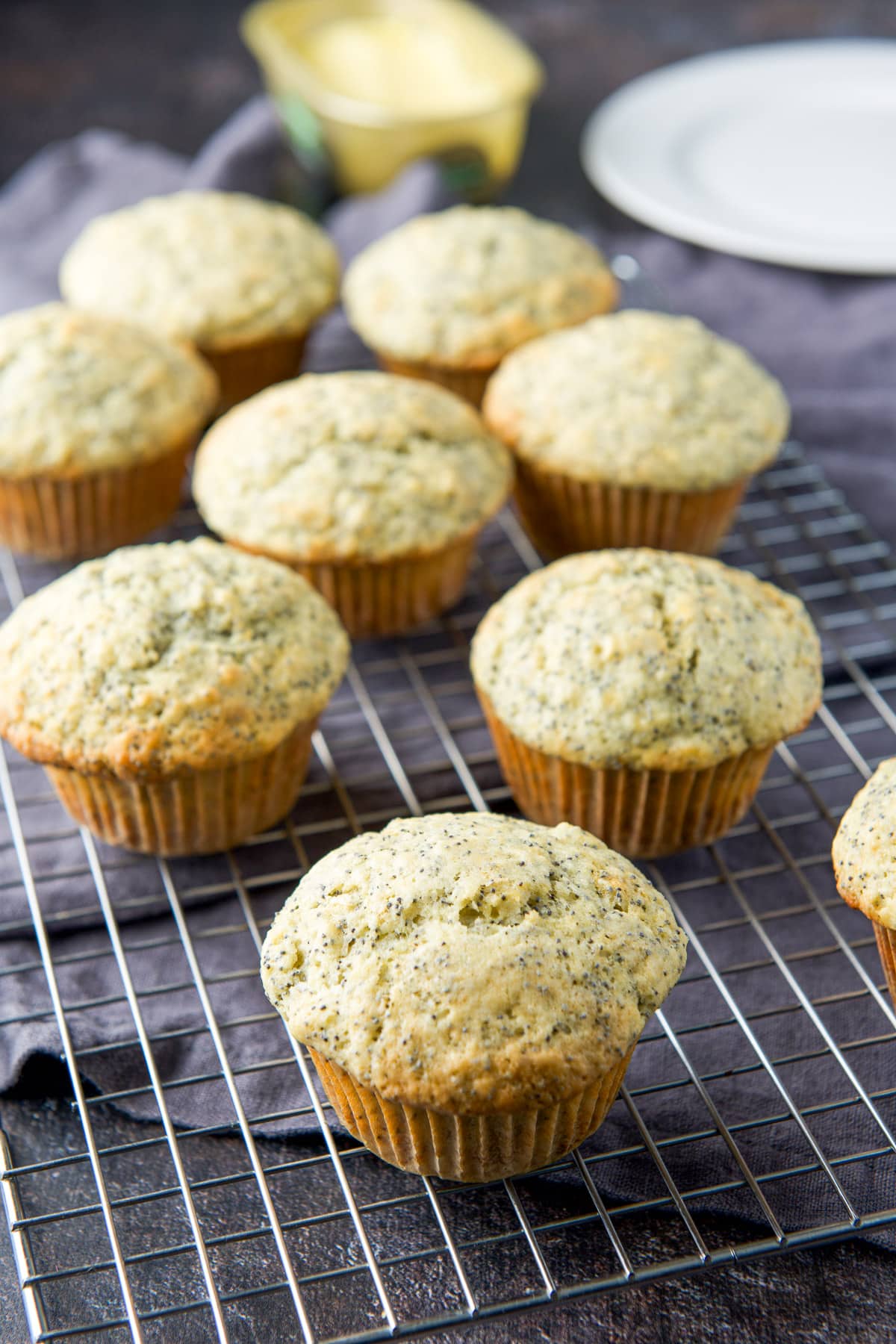 A wire rack with the lemon muffins cooling