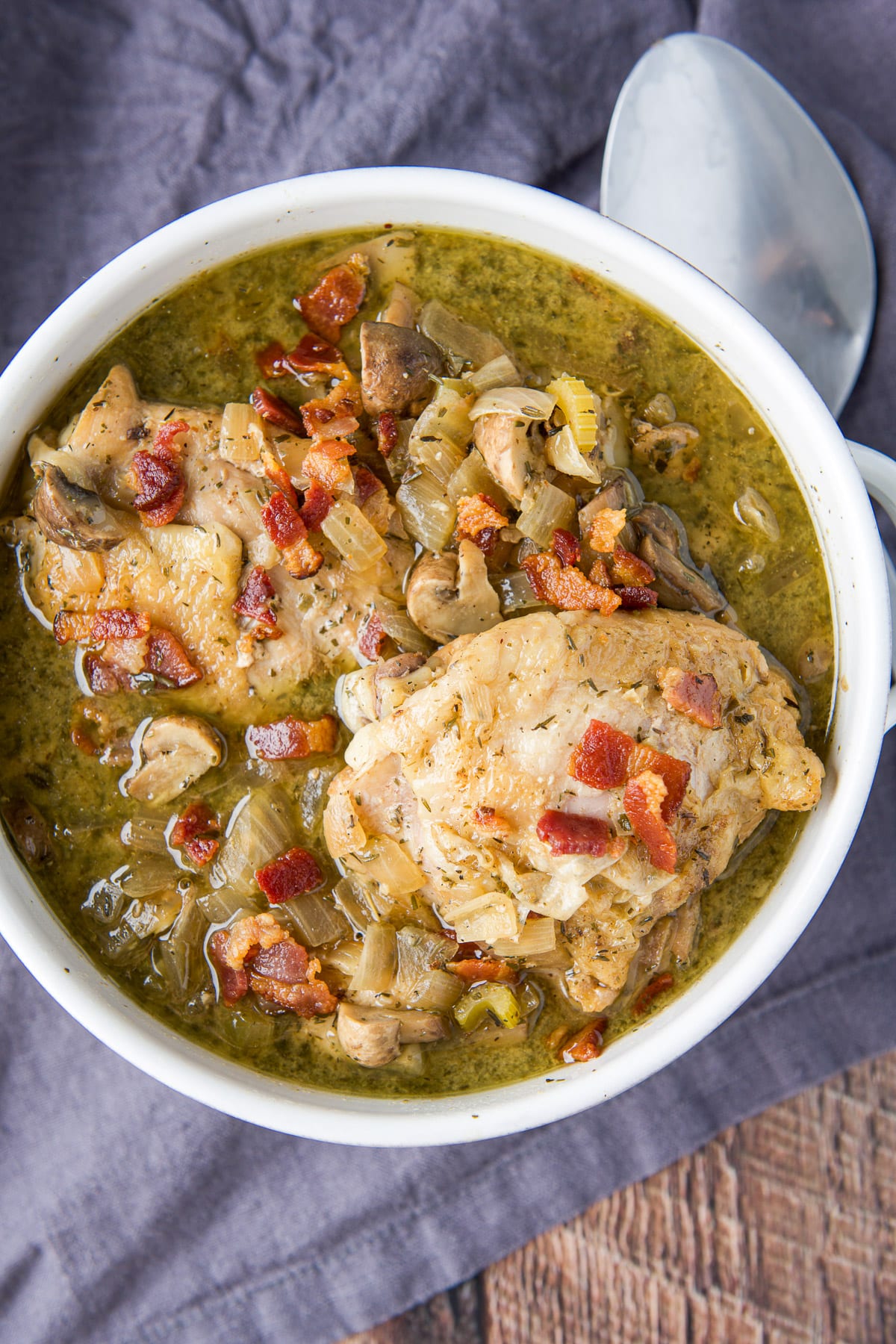 Overhead view of the pan of chicken, bacon, and broth