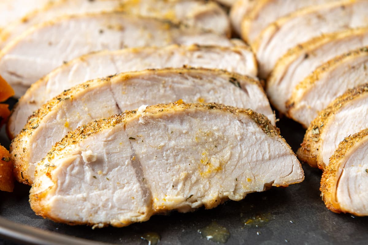 Close up of slices of turkey with spices in them