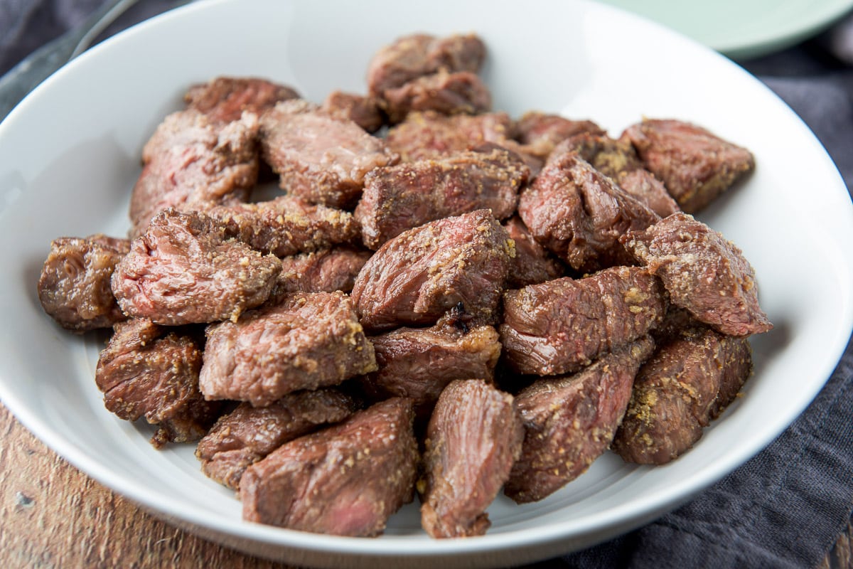 horizontal photo of the medium rare steak tips