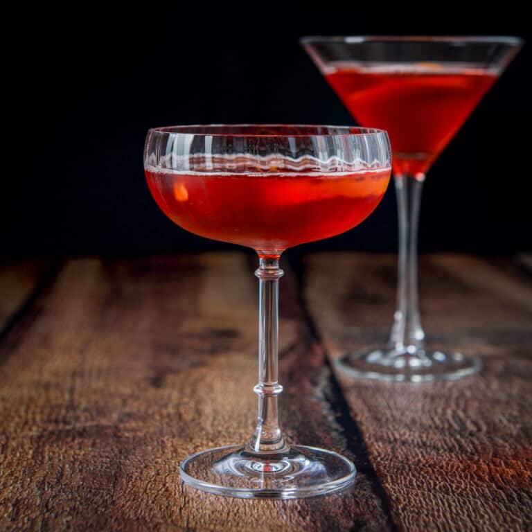 Two martini glasses filled with the classic red cocktail