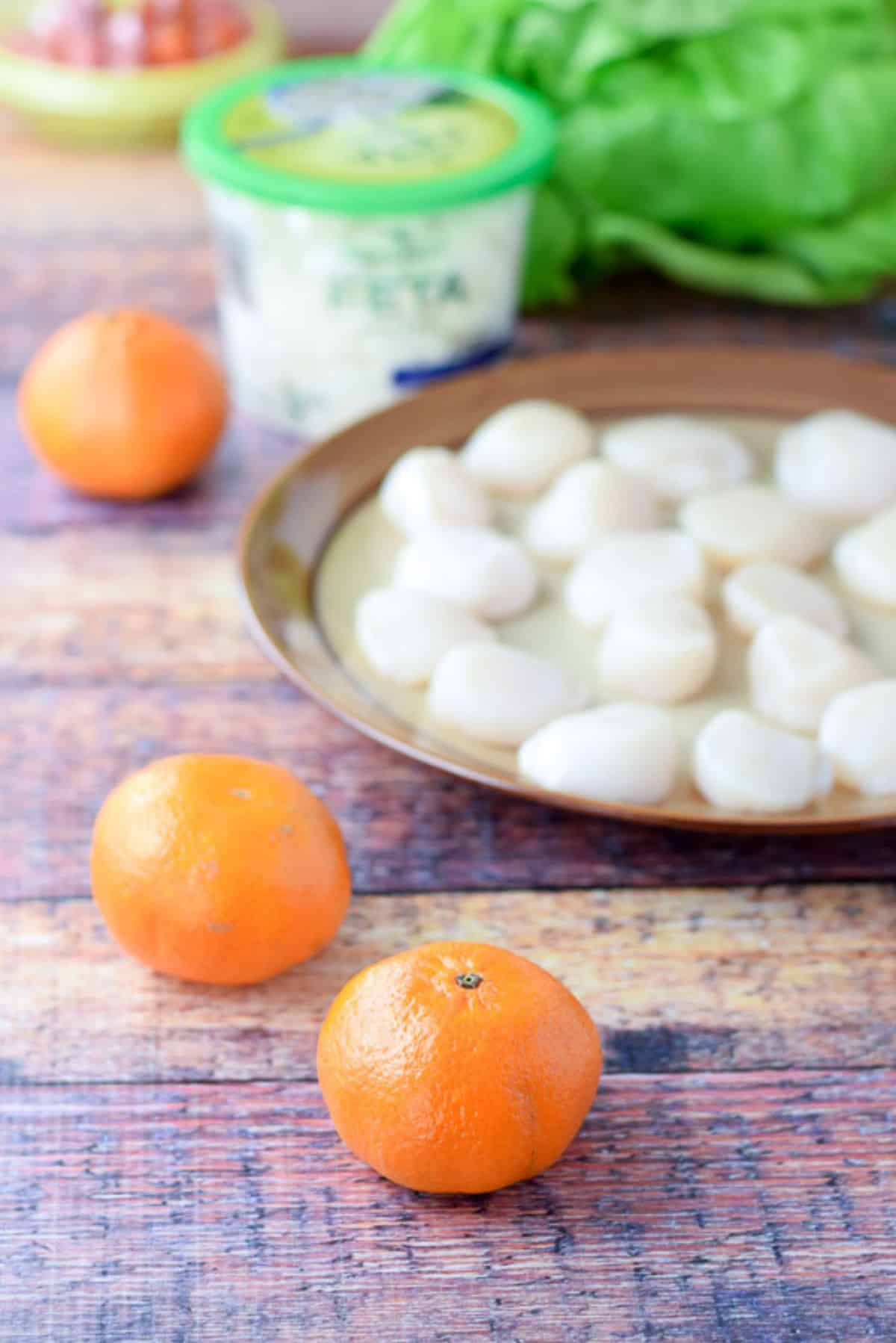 Clementine oranges, scallops, feta cheese, Boston lettuce and tomatoes