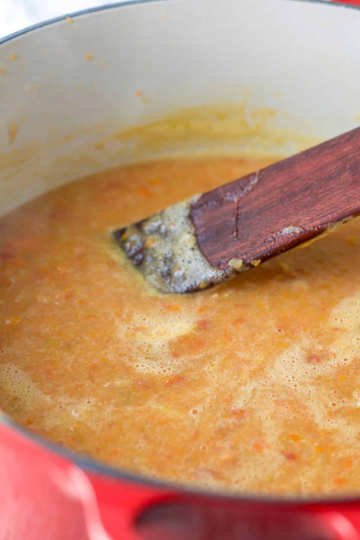 The white bean soup blended in the pan before the farro is added