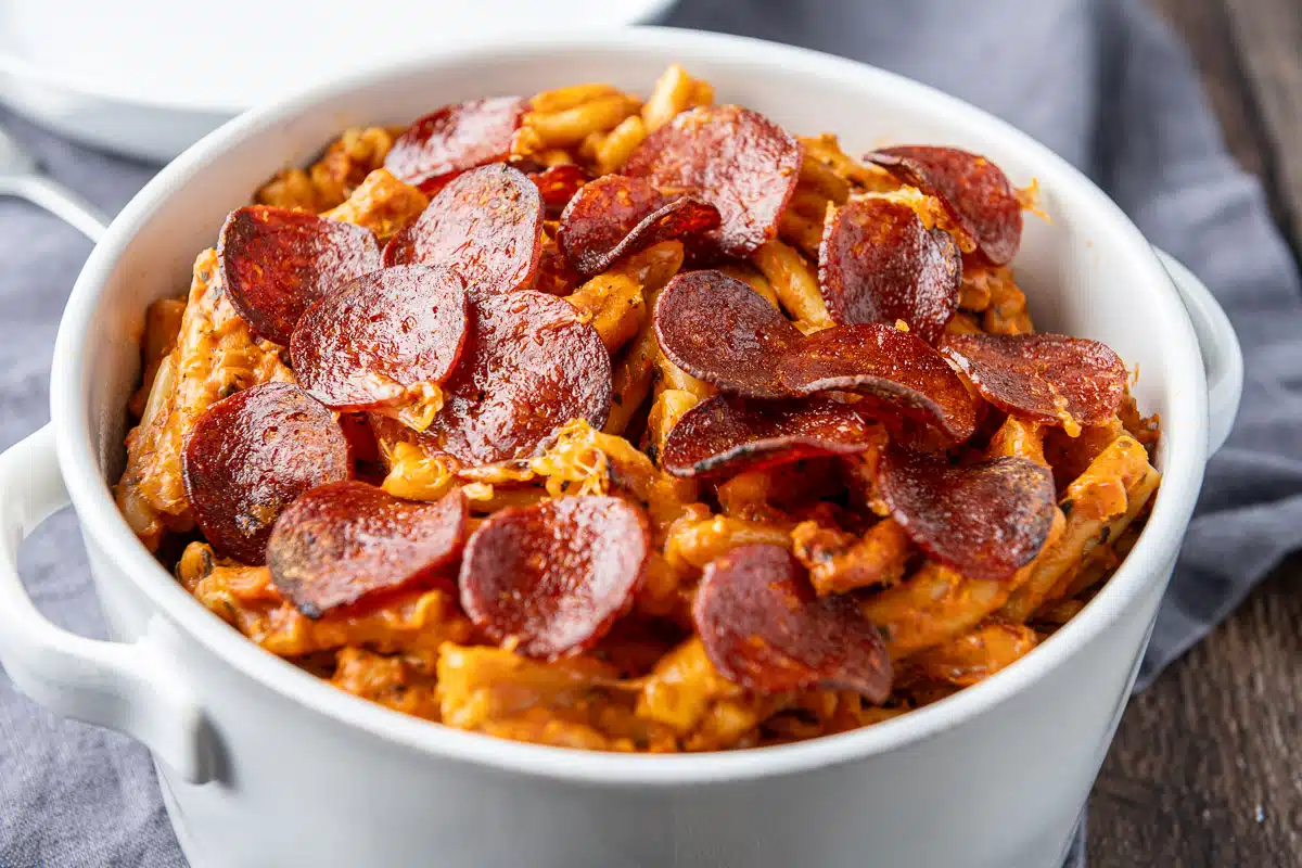 horizontal photo of the white pan with pasta and crispy pepperoni