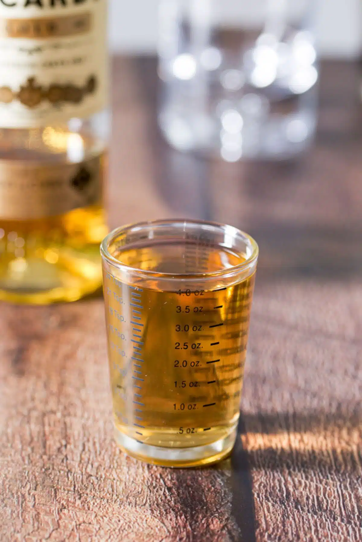 Rum poured out in a measuring glass
