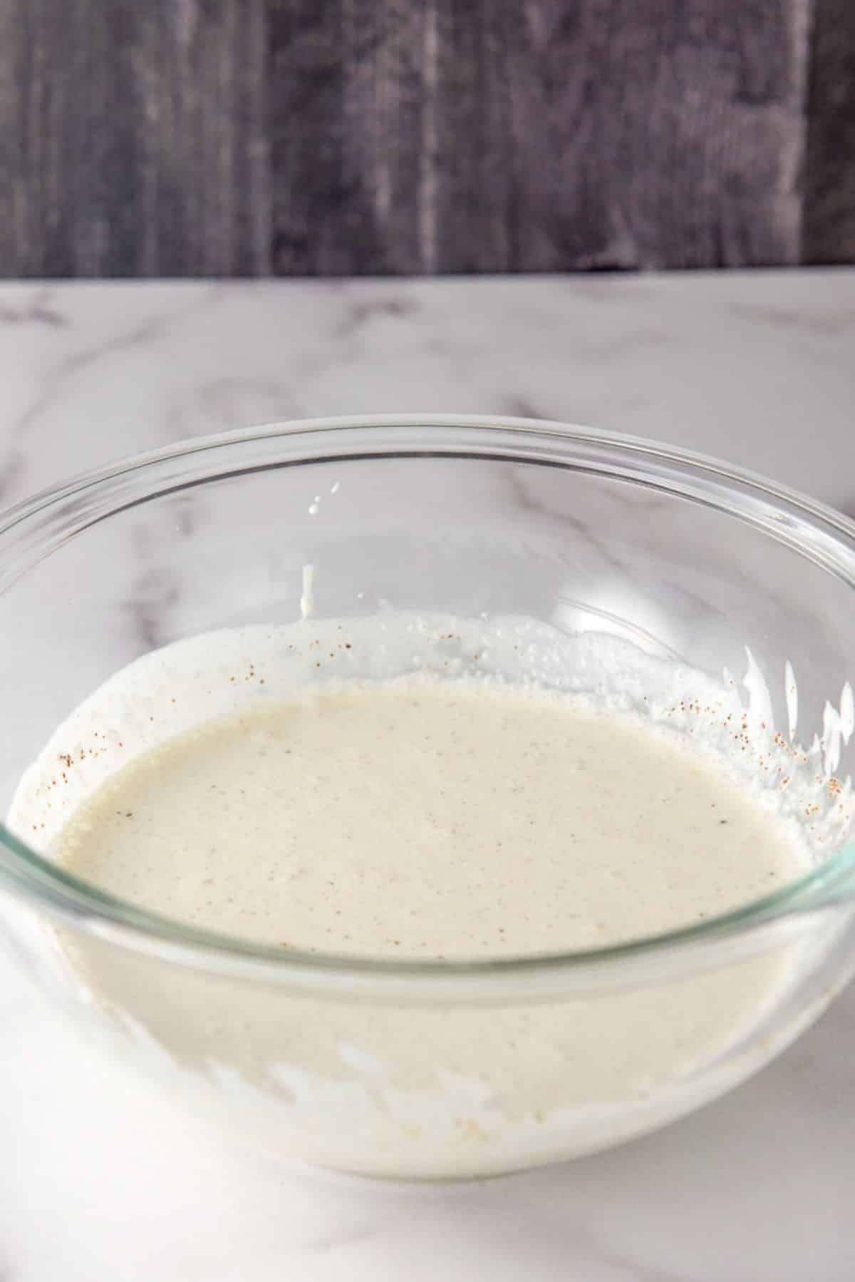 The Mexican crema whisked in a clear bowl
