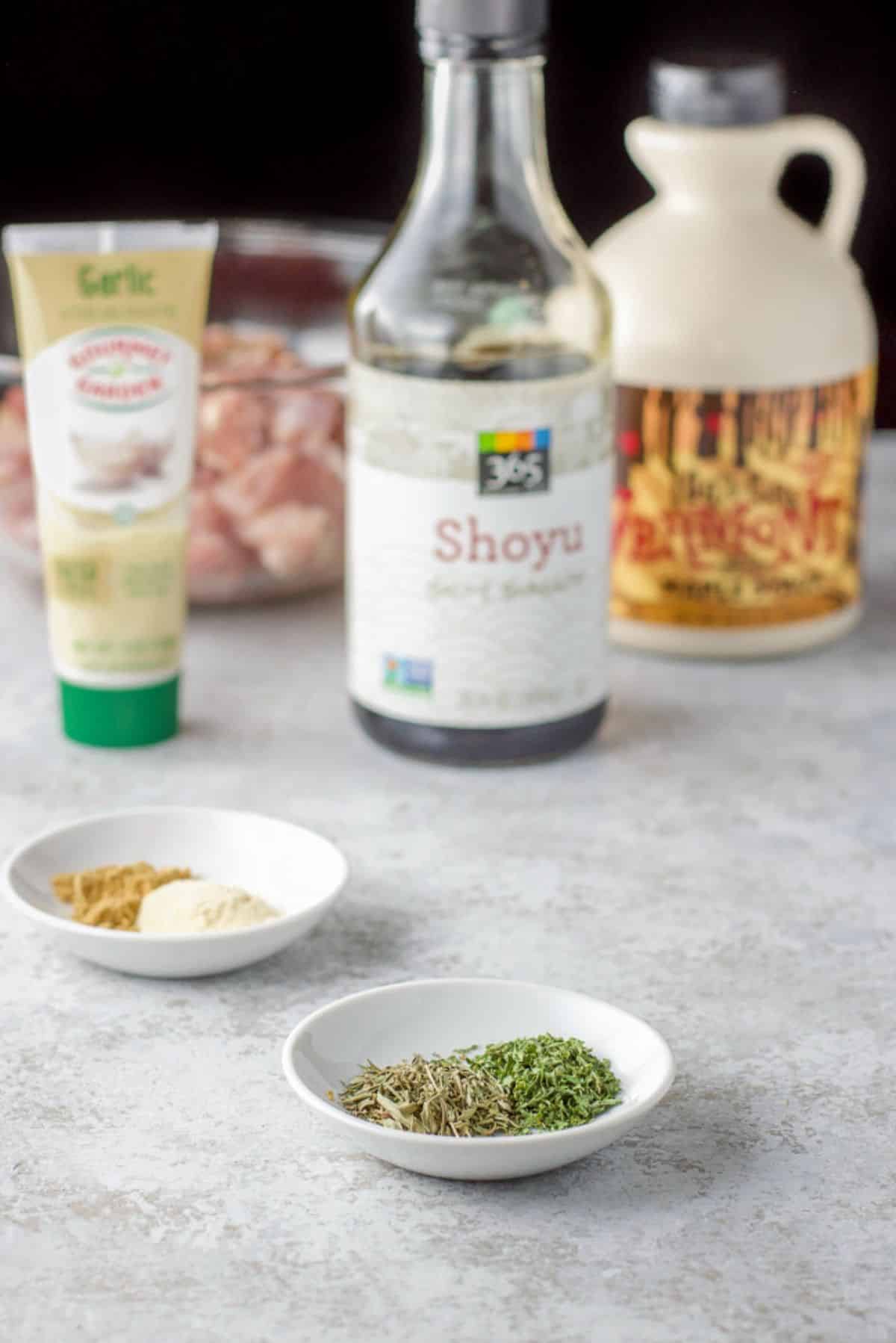 Herbs, spices, garlic paste, soy sauce, maple syrup, and chicken
