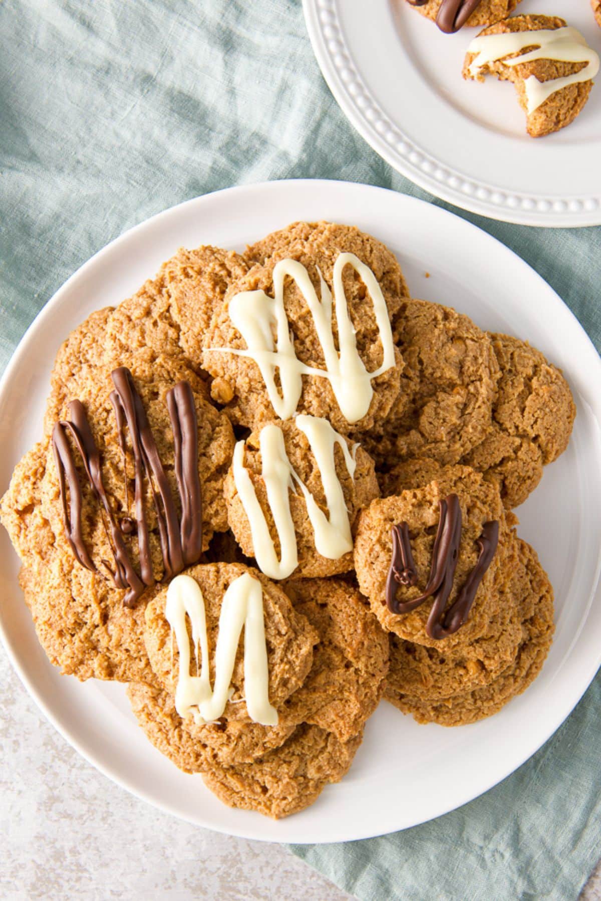 Overhead view of the pile of plain, white and chocolate covered butterscotch cookies